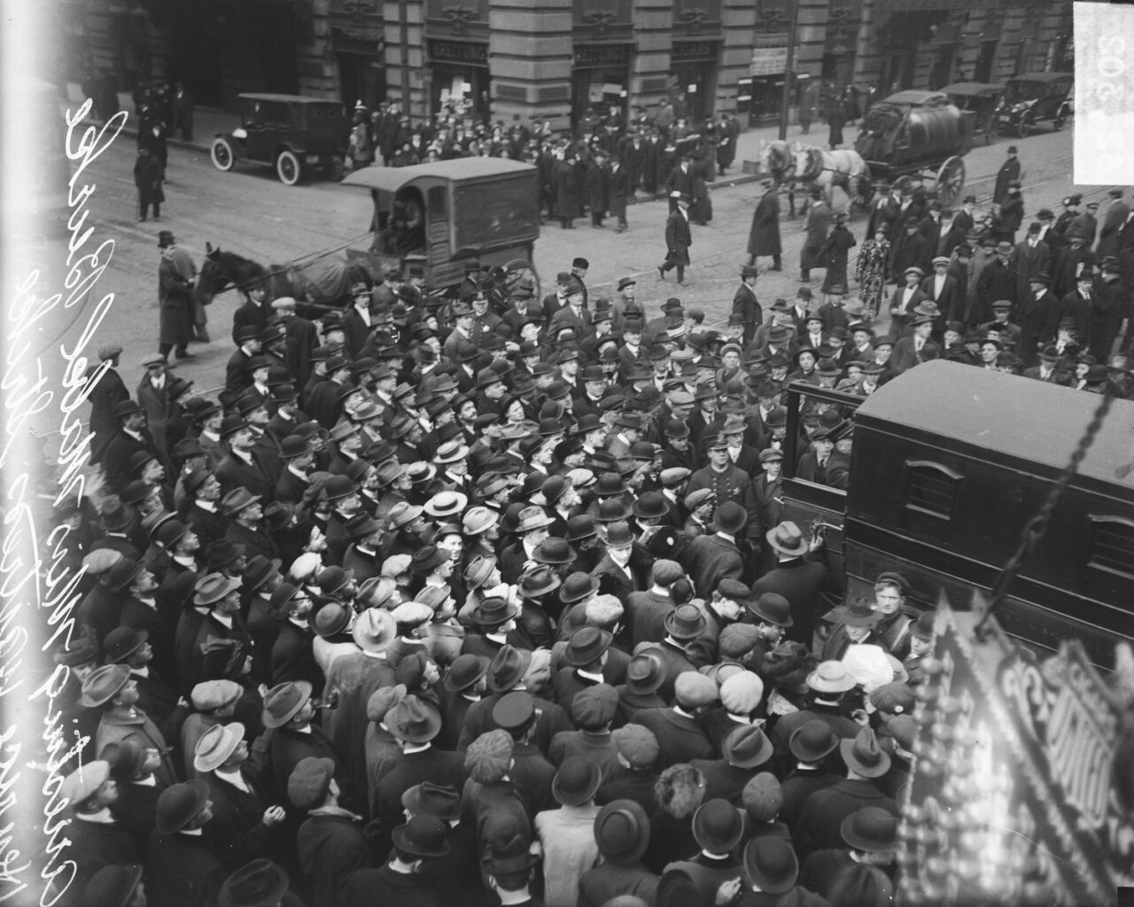 Henrici restaurant waitress strike, Mabel Burke being arrested, with crowds of people watching at an intersection